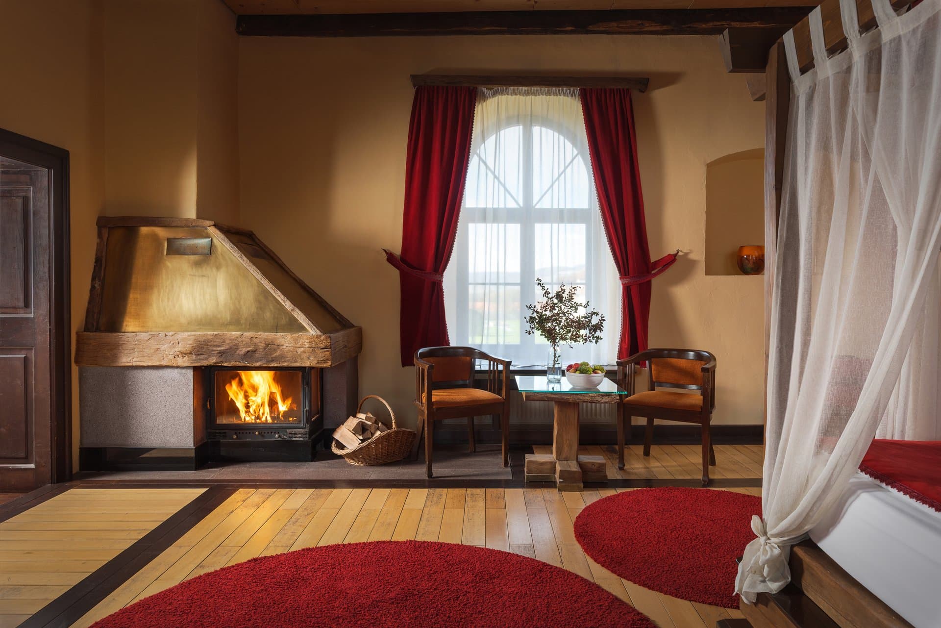 The Swan Suite - elegant interior with fireplace and baldaquin bed