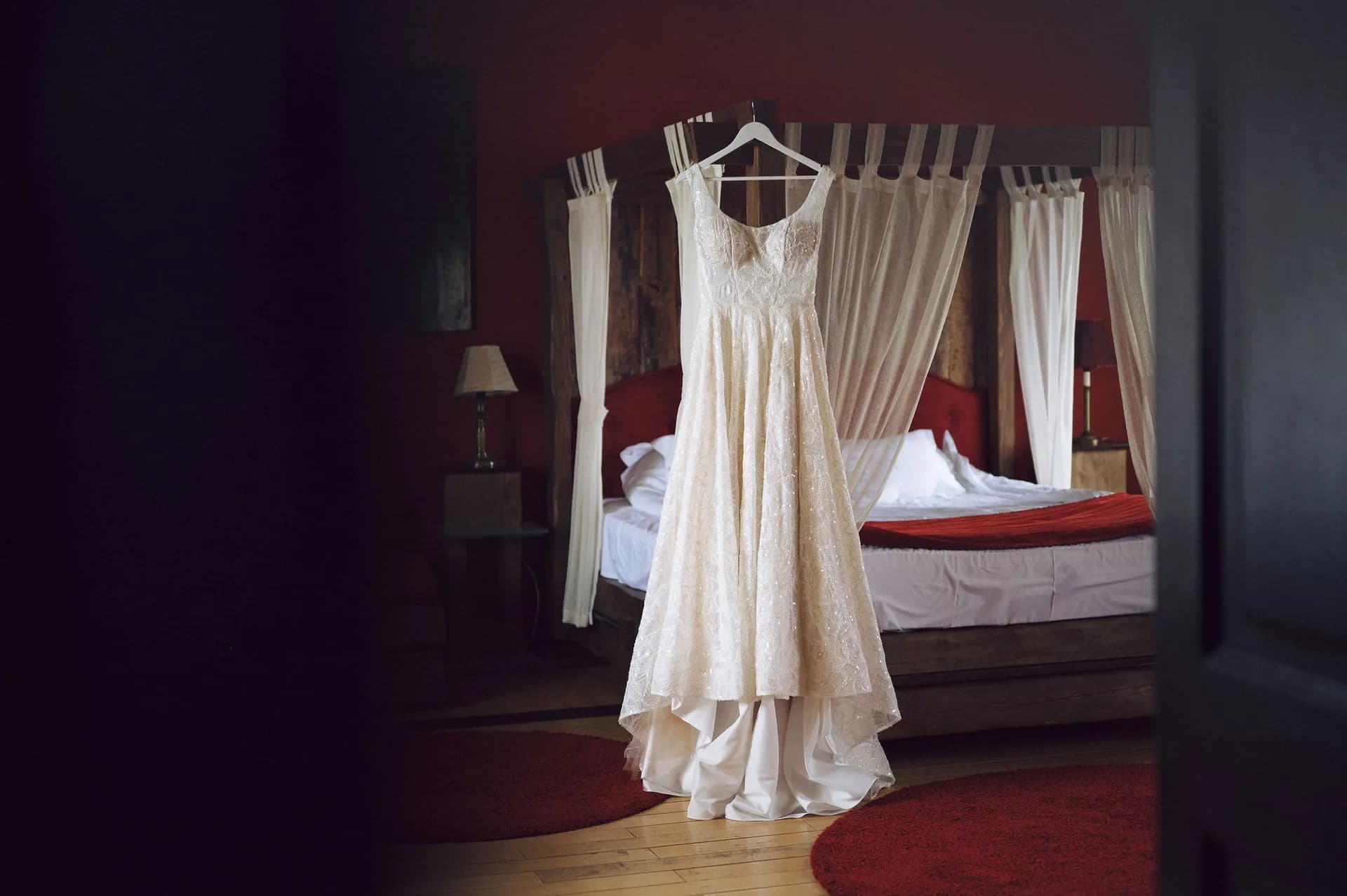 Wedding dress hanging in a castle room